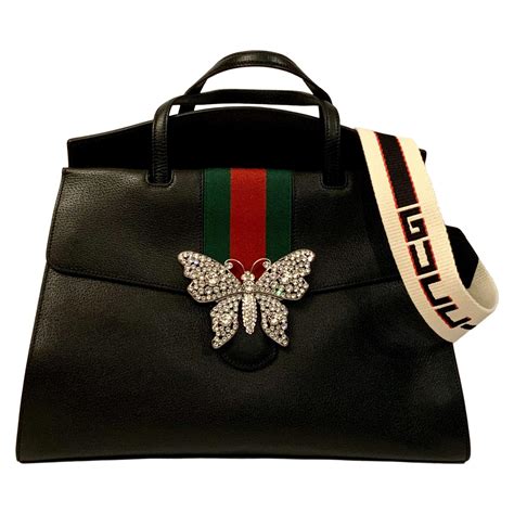 gucci bag john lewis|Gucci bag with butterfly buckle.